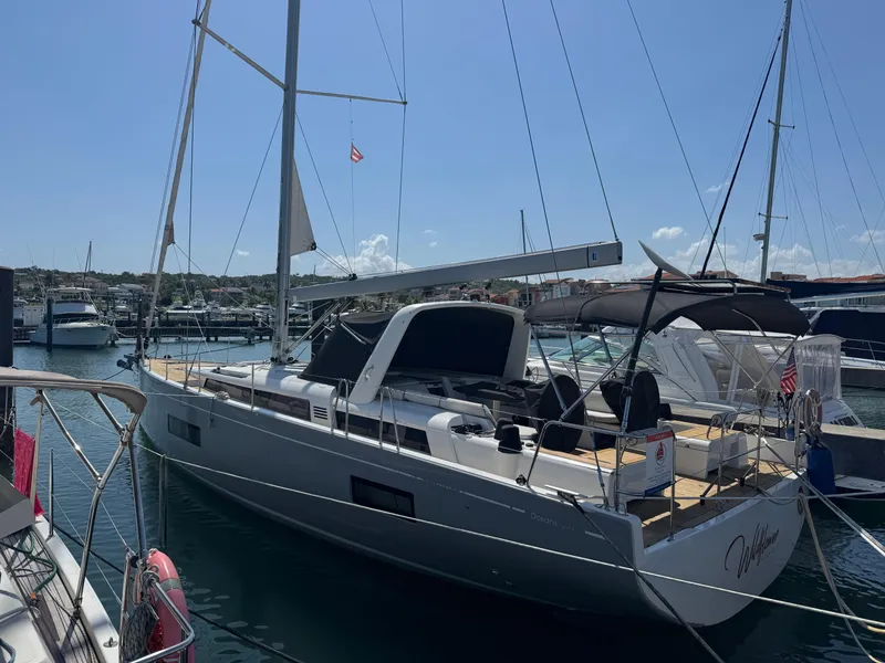Slide: The Image of 2021 Beneteau Oceanis Yacht 54 docked at marina under clear sky. - 5