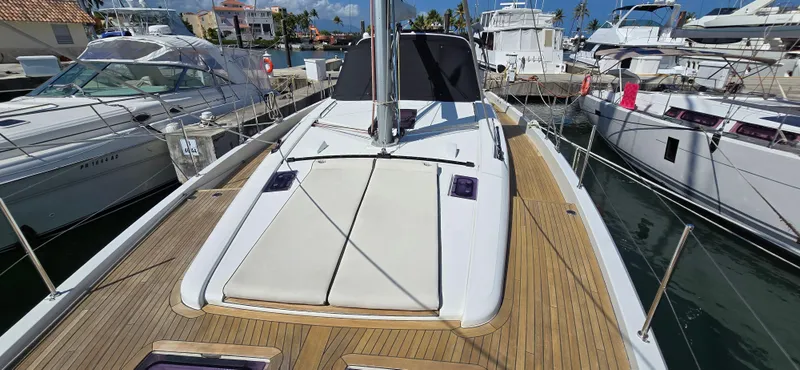 Slide: The Image of 2021 Beneteau Oceanis Yacht 54 docked, showcasing sleek deck design and modern features. - 8