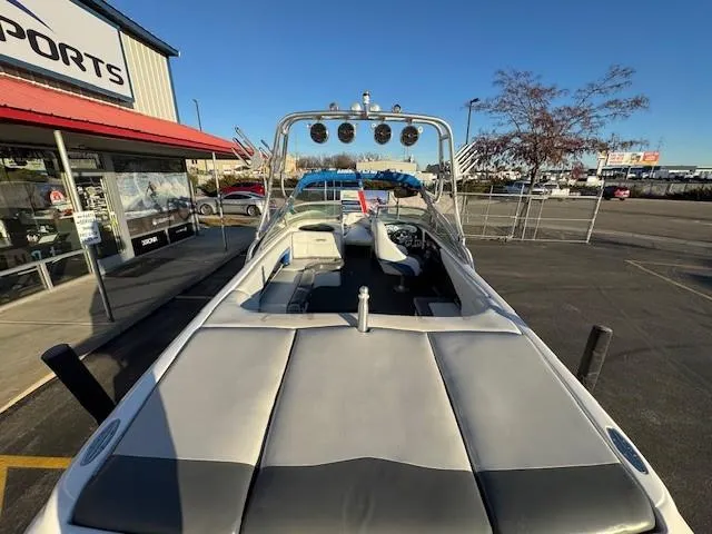 Slide: The Image of 2004 MasterCraft X-30 boat with sleek interior, parked outside a sports store. - 11