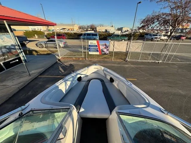 Slide: The Image of 2004 MasterCraft X-30 boat parked in a lot, viewed from the bow. - 12