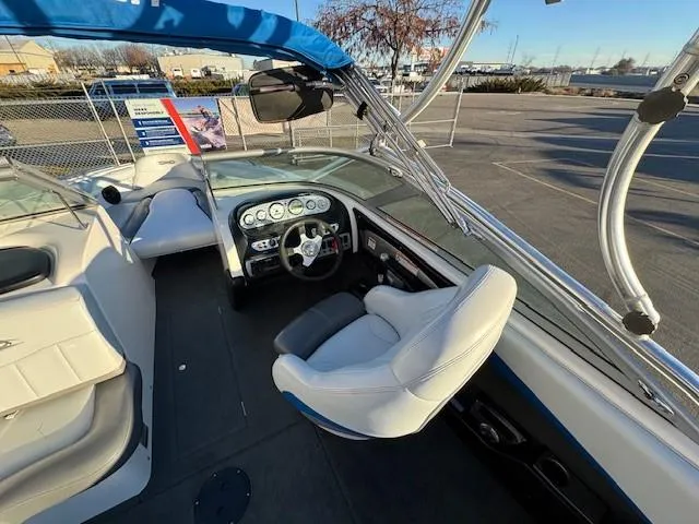 Slide: The Image of 2004 MasterCraft X-30 boat interior with steering wheel and seating. - 13