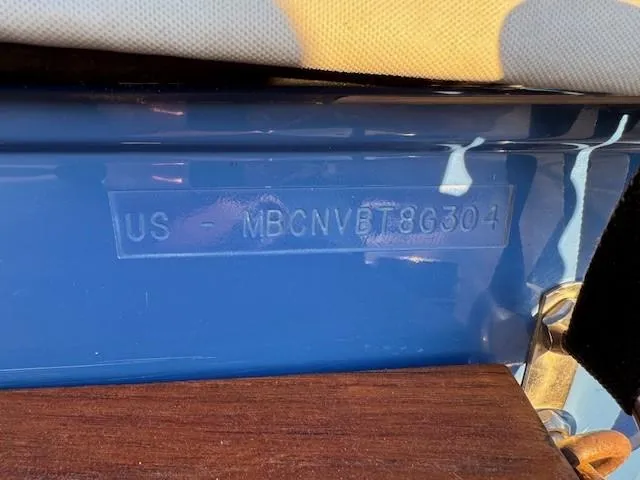 Slide: The Image of 2004 MasterCraft X-30 boat hull identification number on blue surface. - 20