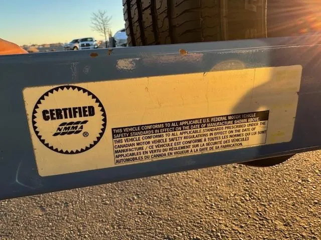Slide: The Image of Certified NMMA label on a 2004 MasterCraft X-30 trailer, highlighting safety compliance. - 21