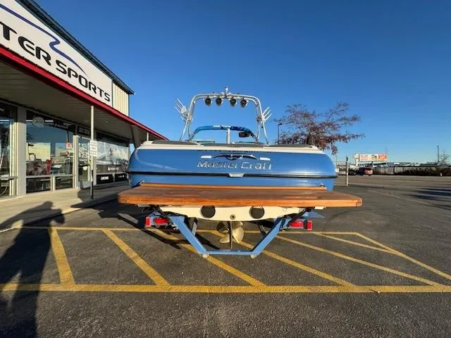 Slide: The Image of 2004 MasterCraft X-30 boat parked outside a dealership on a sunny day. - 4