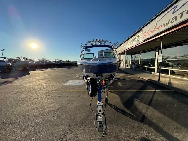 Slide: The Image of 2004 MasterCraft X-30 boat on trailer in sunny dealership lot. - 8