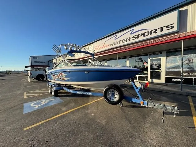 Slide: The Image of 2004 MasterCraft X-30 boat on trailer outside Idaho Water Sports store. - 9