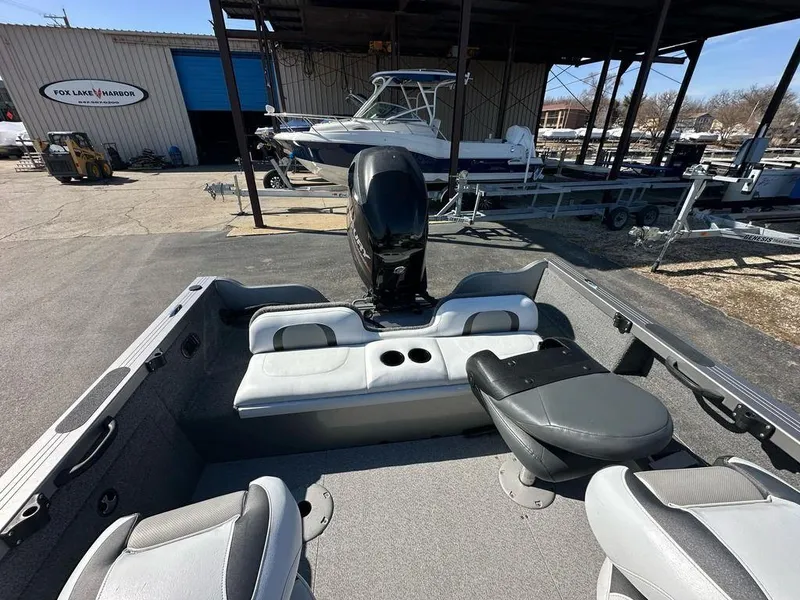 Slide: The Image of 2013 Crestliner Fish Hawk 1750 boat interior with seating and motor at Fox Lake Harbor. - 12