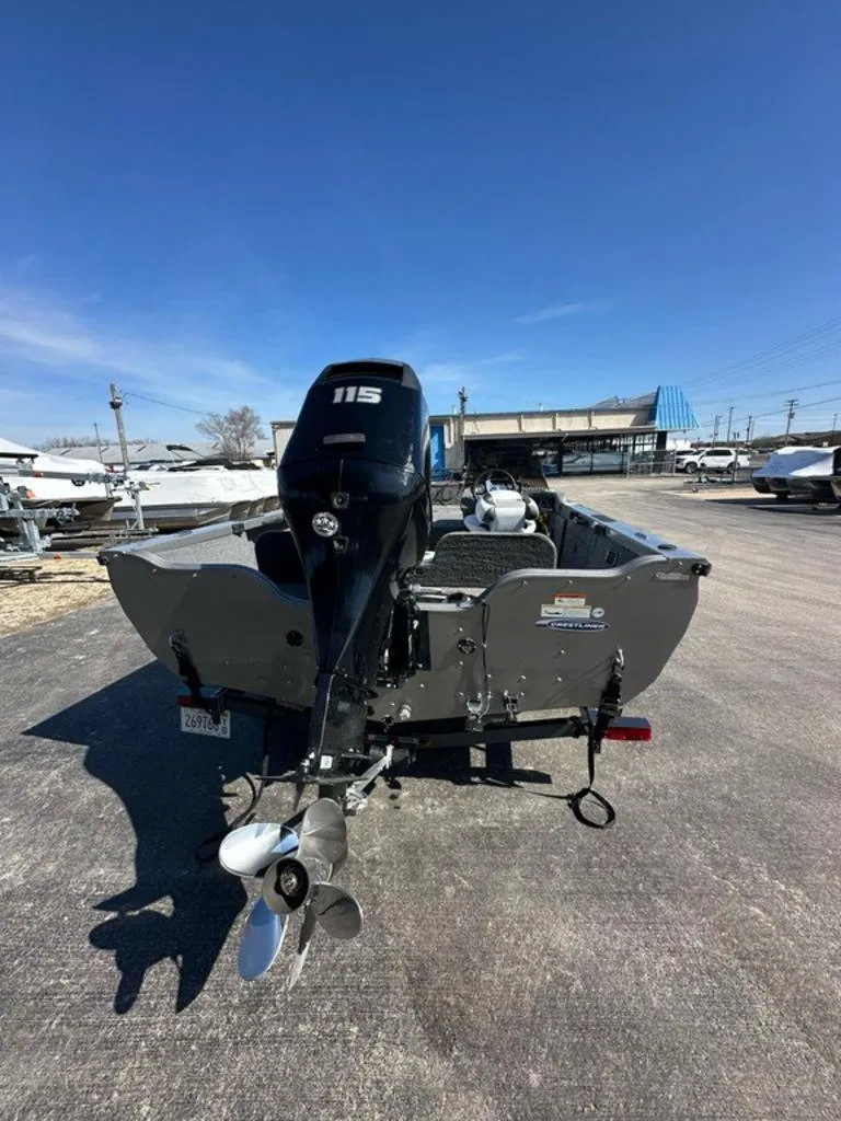 Slide: The Image of 2013 Crestliner Fish Hawk 1750 boat with 115 HP motor, parked outdoors. - 13