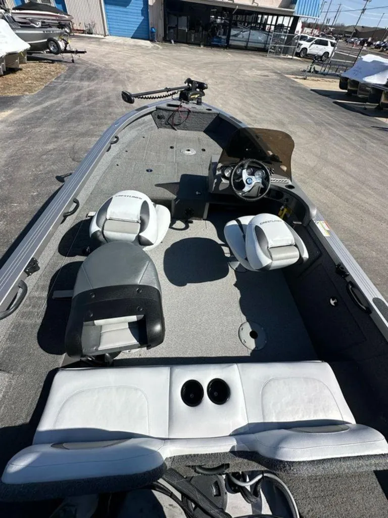 Slide: The Image of 2013 Crestliner Fish Hawk 1750 boat interior with seating and steering console. - 3