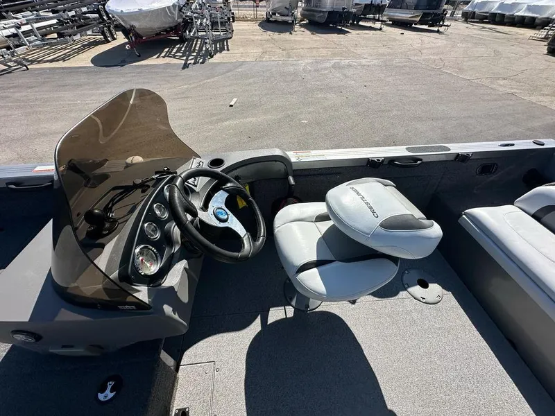 Slide: The Image of 2013 Crestliner Fish Hawk 1750 boat interior with steering console and seating. - 8