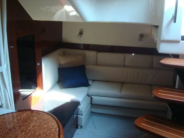 Slide: The Image of Luxurious interior of 2010 Sea Ray 390 Sundancer yacht with plush seating and elegant design. - 17