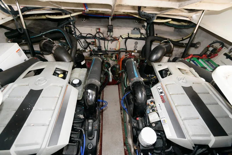 Slide: The Image of Engine room of 2010 Sea Ray 390 Sundancer with dual engines and complex wiring. - 19