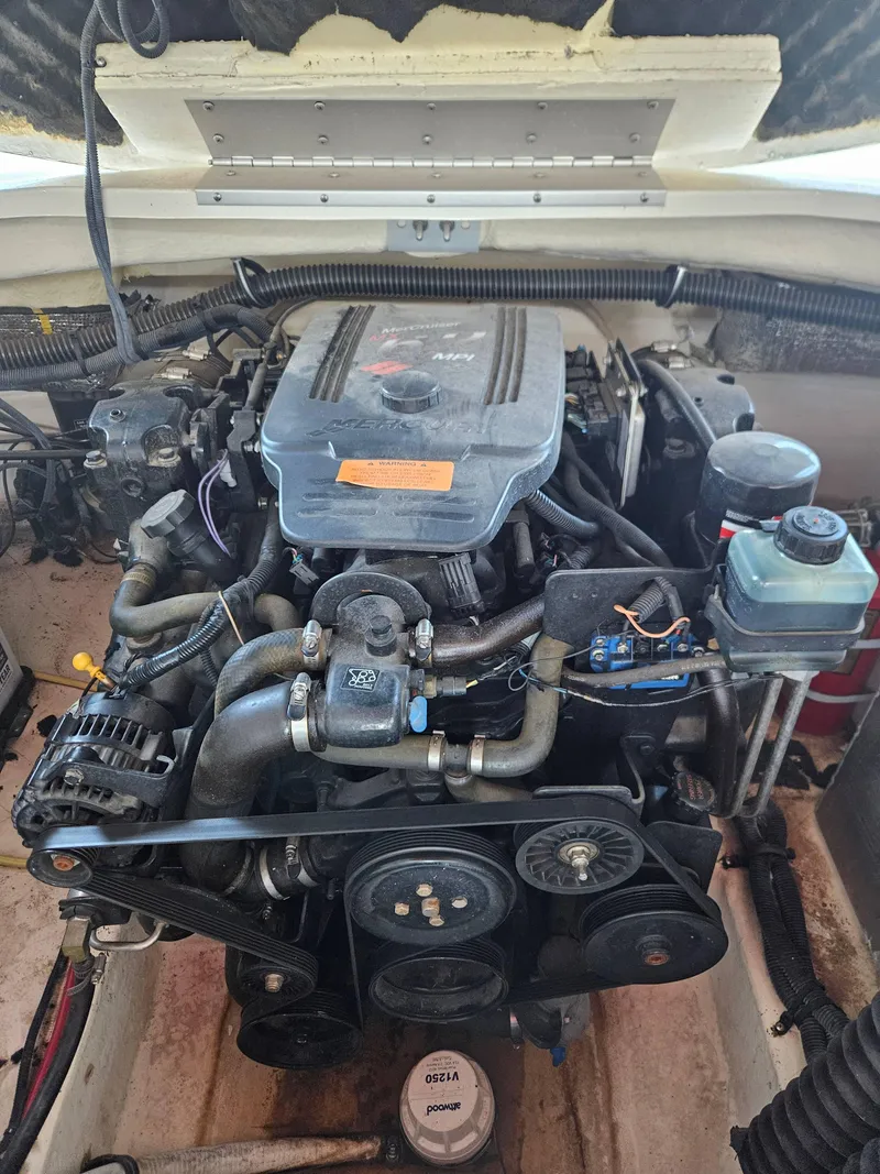 Slide: The Image of Engine of a 2003 Chaparral Sunesta 263 boat, showcasing mechanical components. - 13