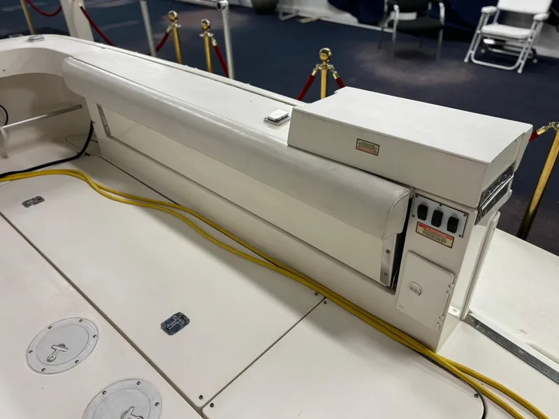 Slide: The Image of 1999 Sea Ray 370 Express Cruiser deck with seating and control panel. - 29