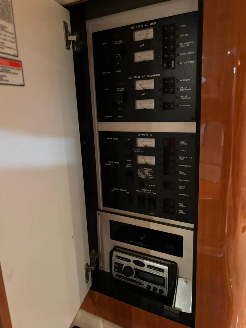 Slide: The Image of Electrical panel inside a 1999 Sea Ray 370 Express Cruiser yacht. - 36