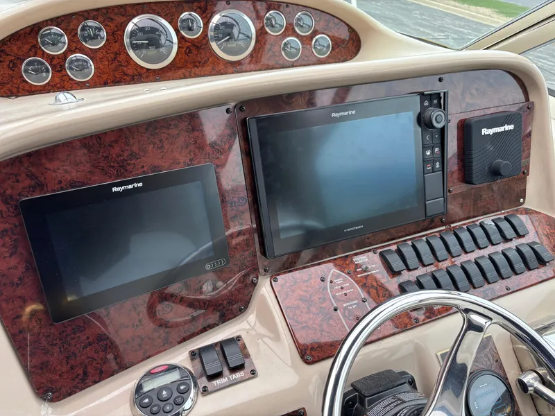 Slide: The Image of Control panel of a 1999 Sea Ray 370 Express Cruiser with Raymarine displays. - 7
