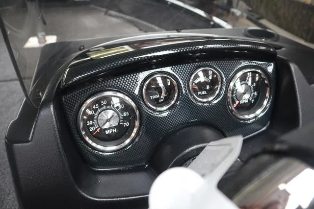 Slide: The Image of Dashboard of 2025 Lowe FM 1775 SC boat with speedometer, trim, fuel, and RPM gauges. - 12