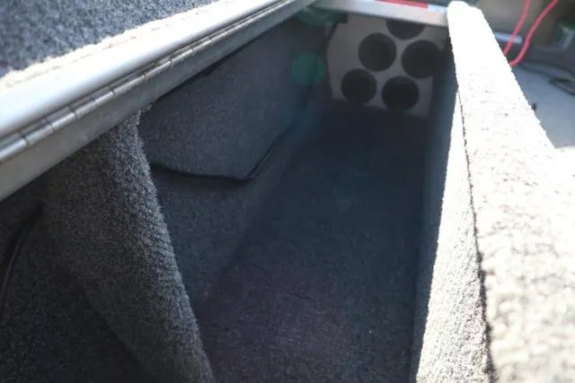 Slide: The Image of Interior storage compartment of 2013 Alumacraft Navigator 165 CS boat. - 10