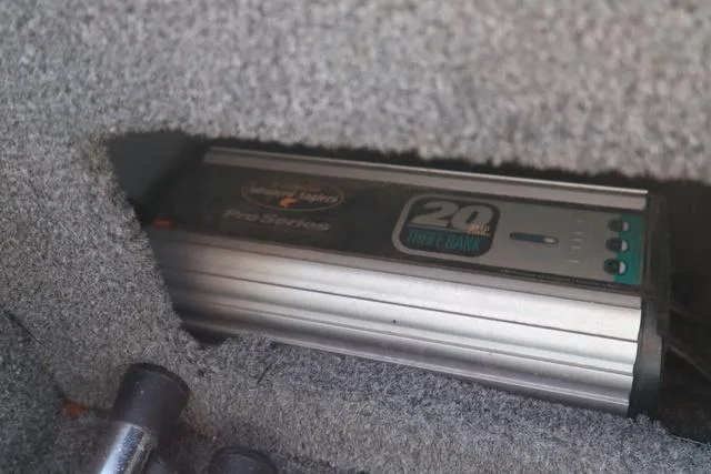 Slide: The Image of Onboard charger in 2013 Alumacraft Navigator 165 CS boat compartment. - 15