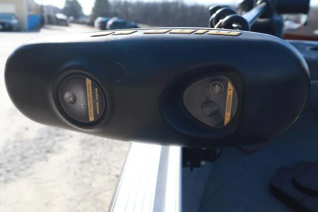 Slide: The Image of Close-up of a 2013 Alumacraft Navigator 165 CS boat component, featuring control buttons. - 20