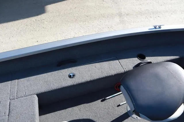 Slide: The Image of 2013 Alumacraft Navigator 165 CS boat interior with seating and carpeted flooring. - 8