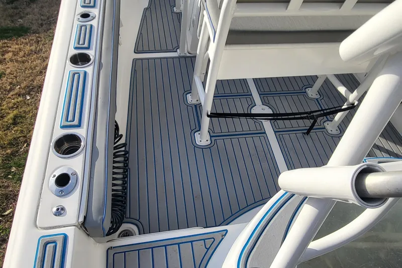 Slide: The Image of 2012 Sea Fox 216 boat deck with rod holders and non-slip flooring. - 10