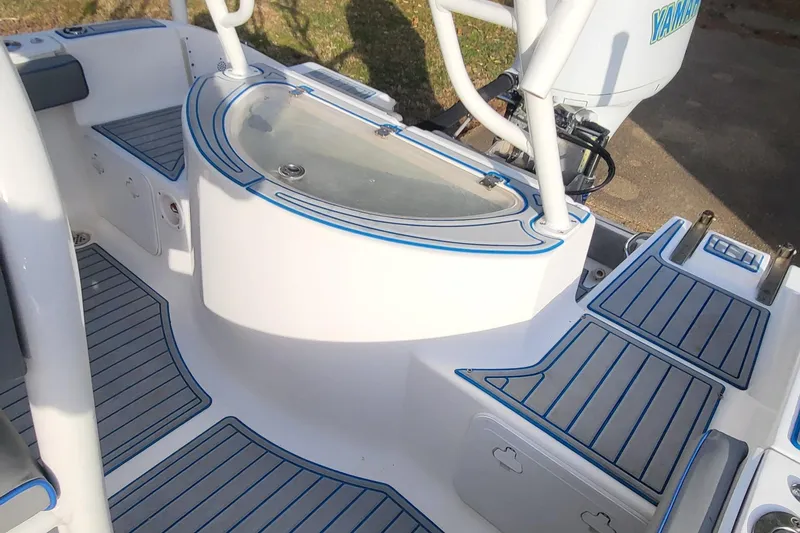 Slide: The Image of 2012 Sea Fox 216 boat interior with non-slip flooring and Yamaha engine. - 11
