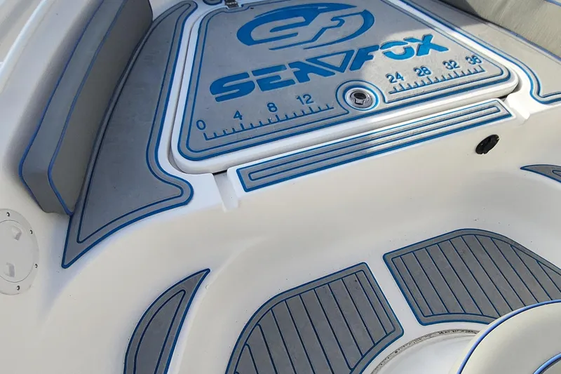 Slide: The Image of Sea Fox 216 boat deck, 2012 model, featuring blue and gray design elements. - 14