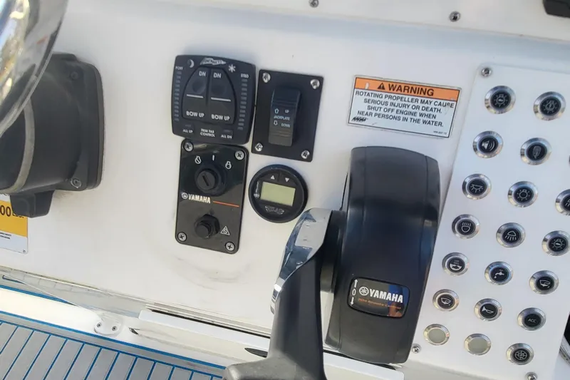 Slide: The Image of Control panel of a 2012 Sea Fox 216 boat with Yamaha components and warning label. - 24