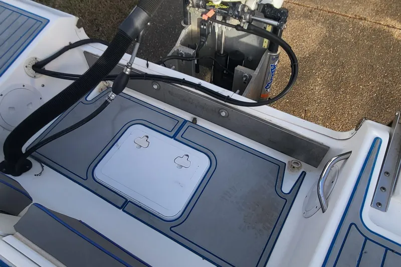 Slide: The Image of 2012 Sea Fox 216 boat deck with storage hatch and motor view. - 6