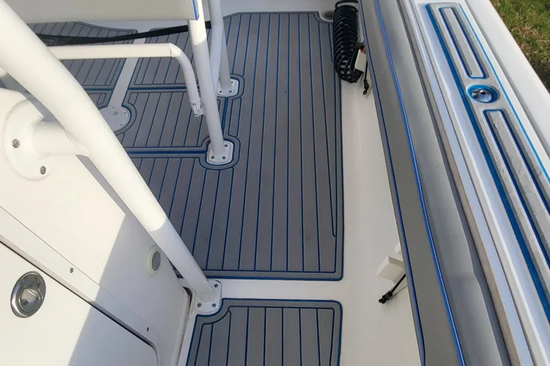 Slide: The Image of 2012 Sea Fox 216 boat interior with non-slip flooring and seating area. - 8