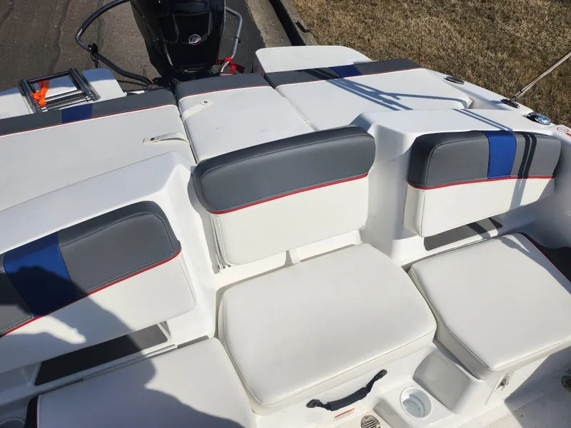 Slide: The Image of 2023 Tahoe T18 boat interior with cushioned seating and modern design. - 20