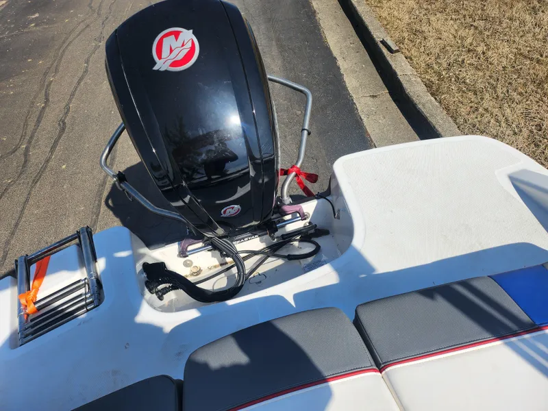 Slide: The Image of 2023 Tahoe T18 boat engine and seating area, featuring sleek design and modern features. - 22