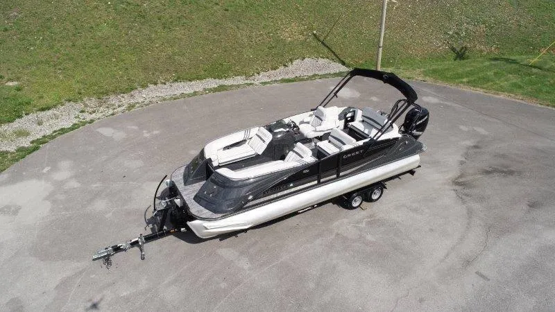 Slide: The Image of 2018 Crest Savannah 250 NX-L pontoon boat on trailer, parked on paved surface. - 1
