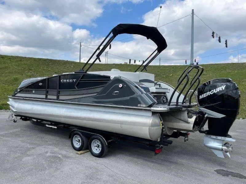 Slide: The Image of 2018 Crest Savannah 250 NX-L pontoon boat on trailer with Mercury outboard motor. - 15