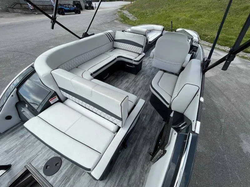 Slide: The Image of 2018 Crest Savannah 250 NX-L pontoon boat with spacious seating and modern design. - 23