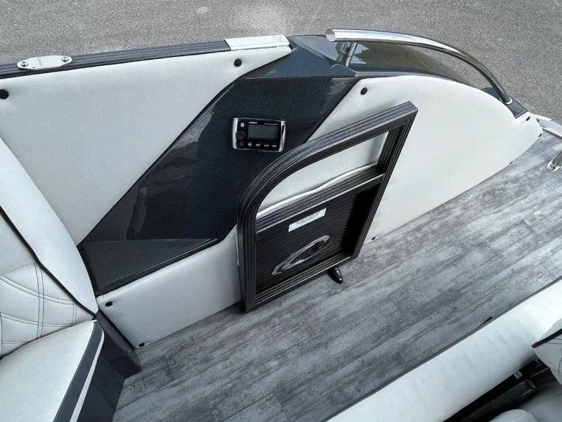 Slide: The Image of 2018 Crest Savannah 250 NX-L boat interior with sleek seating and modern control panel. - 24