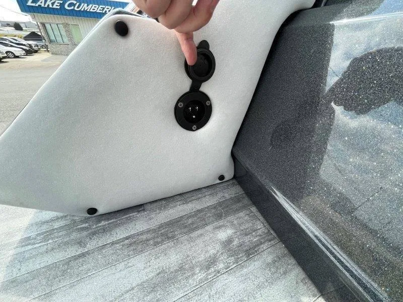 Slide: The Image of 2018 Crest Savannah 250 NX-L boat detail with a person pointing at a plug socket. - 33