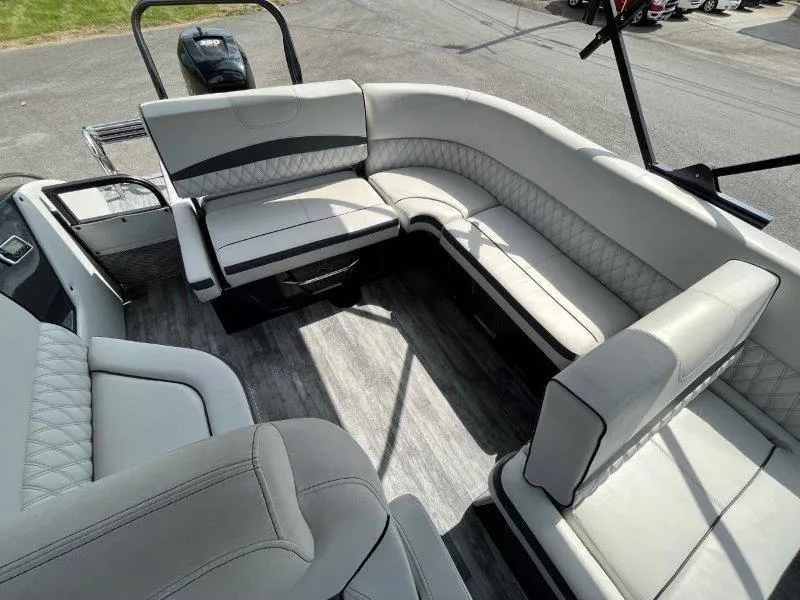Slide: The Image of 2018 Crest Savannah 250 NX-L pontoon boat interior with luxurious seating and modern design. - 36