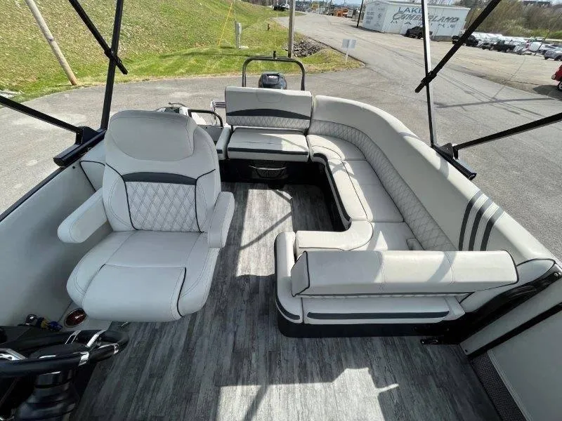 Slide: The Image of 2018 Crest Savannah 250 NX-L pontoon boat interior with plush seating and modern design. - 45