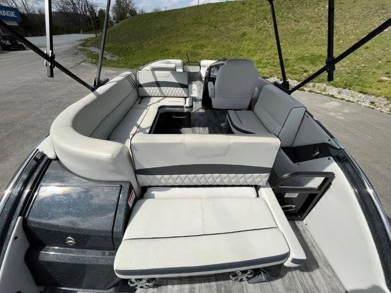 Slide: The Image of 2018 Crest Savannah 250 NX-L pontoon boat interior with spacious seating and modern design. - 46