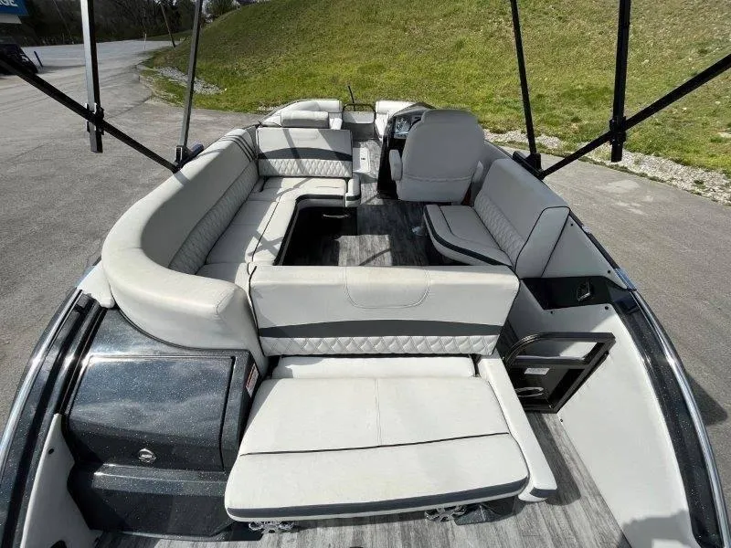 Slide: The Image of 2018 Crest Savannah 250 NX-L pontoon boat interior with spacious seating and modern design. - 48