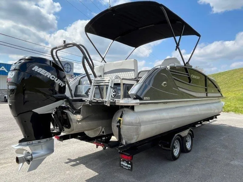 Slide: The Image of 2018 Crest Savannah 250 NX-L pontoon boat with Mercury engine on trailer. - 49