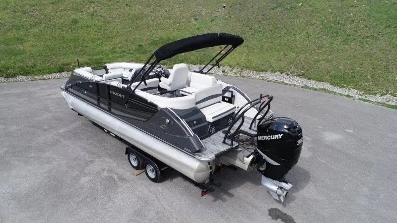 Slide: The Image of 2018 Crest Savannah 250 NX-L pontoon boat with Mercury engine on trailer. - 6