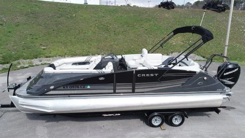 Slide: The Image of 2018 Crest Savannah 250 NX-L pontoon boat on trailer, side view. - 7