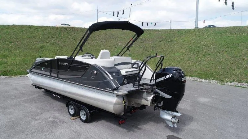 Slide: The Image of 2018 Crest Savannah 250 NX-L pontoon boat with Mercury outboard motor on a trailer. - 8