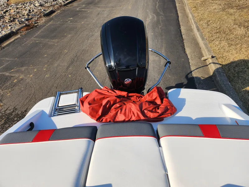 Slide: The Image of 2022 Tahoe T16 boat with outboard motor and red cover on deck. - 20