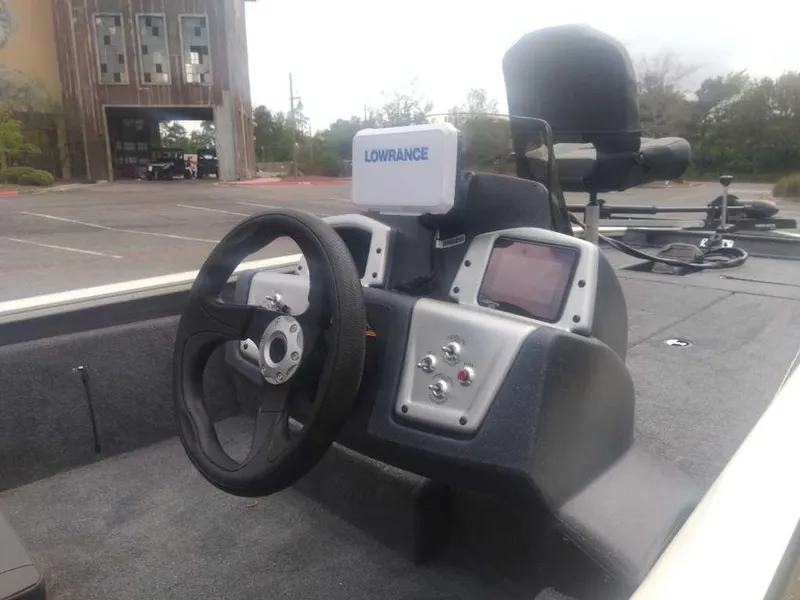 Slide: The Image of 2025 Tracker Pro Team 190 boat dashboard with Lowrance electronics and steering wheel. - 4