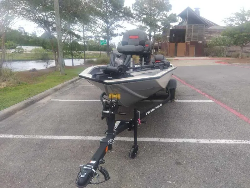 Slide: The Image of 2025 Tracker Pro Team 190 boat on trailer in parking lot. - 6