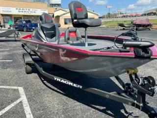 Slide: The Image of 2025 Tracker Pro Team 175 boat on trailer in parking lot. - 2